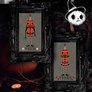 May include: Two framed cross-stitch samplers with Halloween themes. Each features a pumpkin-headed figure in orange and black, with the words "TRICK" and "TREAT" below. The frames are ornate black, and the text "The Witchy Stitcher" is at the top.