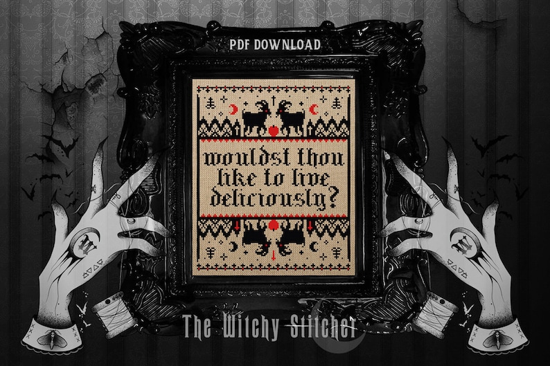 May include: A framed cross-stitch design with the text "wouldst thou like to live deliciously?" in gothic lettering. The design features black goats, moons, and stars on a tan background, framed in black. The image is held by illustrated hands.