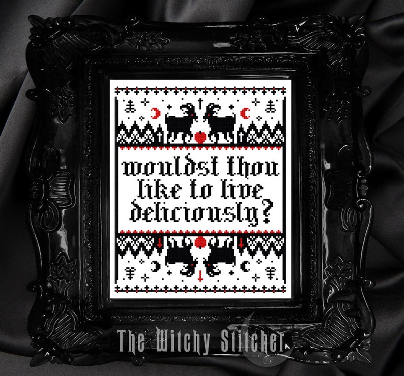May include: Black framed cross-stitch art with the text "Wouldst thou like to live deliciously?" in red and black. The design includes black goats, moons, and other symbols. The Witchy Stitcher is printed at the bottom.