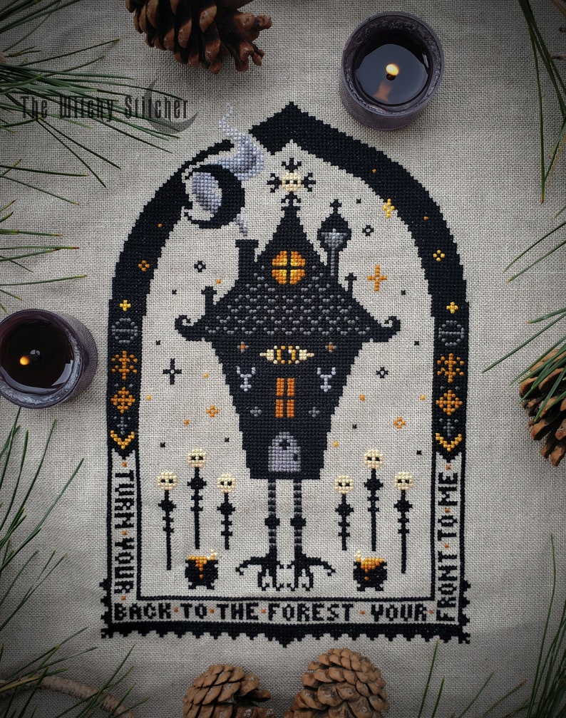 May include: Black and white cross stitch pattern of a spooky house with a black cat and the text "Turn your back to the forest, your front to me".