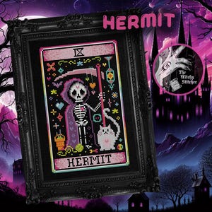May include: A black framed cross-stitch pattern of the Hermit tarot card. The card features a skeleton in a purple robe holding a lantern and a cat. The card is surrounded by a pink border with the word "HERMIT" written in pink letters.