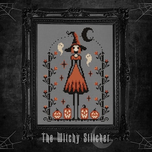 May include: Cross-stitch art of a witch in an orange dress and hat, with ghosts, pumpkins, and a crescent moon. The artwork is framed in a black ornate frame, with the text "The Witchy Stitcher" at the bottom.