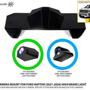 May include: A black high brake light camera mount for a 2021-2026 Ford Raptor. The mount is designed for Wolfbox G900, G930, G840, and G850 cameras. The image includes text labels for camera compatibility and a small inset photo of a white Ford Raptor truck.