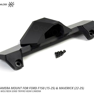 以下が含まれることがあります： フォードF150（15-25）およびマーベリック（22-25）用の黒いWolfboxカメラマウント。マウントは耐久性のある素材で作られており、ネジのセットが含まれています。画像には「WOLFBOX CAMERA MOUNT FOR FORD F150（15-25）＆MAVERICK（22-25）」と書かれています。