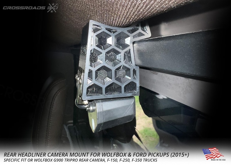 May include: A black rear headliner camera mount with a honeycomb design, designed for Wolfbox and Ford pickups. The mount is shown installed in a vehicle. The text on the image reads "REAR HEADLINER CAMERA MOUNT FOR WOLFBOX & FORD PICKUPS (2015+)".