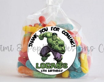 May include: A white circle sticker with a green Hulk character in the center. The sticker says "Thank you for coming! Logan's 6th Birthday".