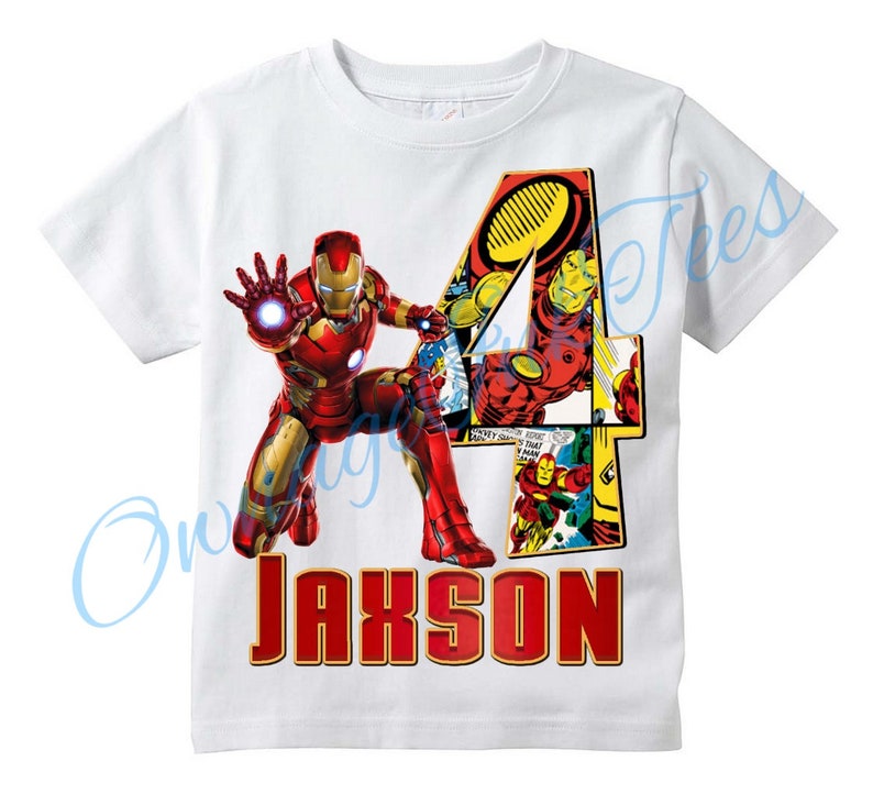 May include: White t-shirt with a red and yellow Iron Man graphic, a red number 4, and the name "Jaxson" in red.