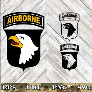 May include: Black and white silhouette of an eagle's head with a yellow beak and red eye, inside a black shield with a white outline. The shield is topped with a black and yellow banner that reads "AIRBORNE".