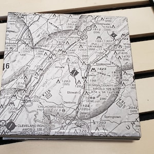 May include: A black and white map of a region with various geographical features, including rivers, roads, and elevation points. The map includes text labels for locations, such as "Etowah", "Springtown", and "Cleveland RGN", as well as elevation numbers and other markings.