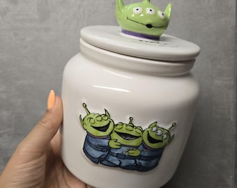 Rae Dunn Pixar Toy Story &quot;The Claaaaw&quot; canister with Alien Head Topper