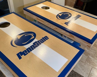 Custom painted personalized cornhole boards.