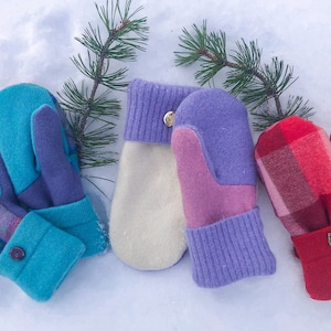 May include: Four pairs of colorful knitted mittens with different patterns. The mittens are made of wool and have a soft, cozy feel. They are perfect for keeping your hands warm in the winter.