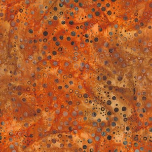 May include: A close-up of a fabric with an abstract design. The fabric features a mottled pattern in shades of orange, brown, and tan, with scattered dark gray and light gray circles of varying sizes. The overall effect is a textured, organic look.
