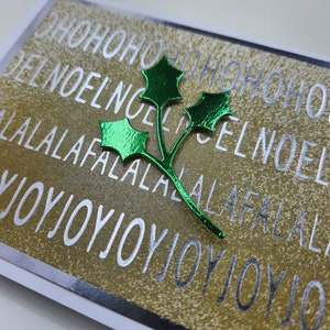 Carte de vœux de Noël - houx vert avec des mots en aluminium
