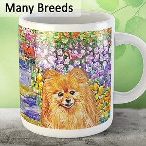 May include: White ceramic coffee mug with a colorful floral design and a small orange Pomeranian dog in the center. The text "Many Breeds" is at the top of the mug.