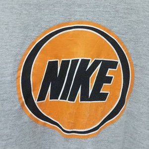 May include: A set of three ceramic vases in varying sizes and shapes. The vases are glazed in a matte white finish and feature a textured, ridged design. They are arranged on a neutral surface, showcasing their minimalist aesthetic.