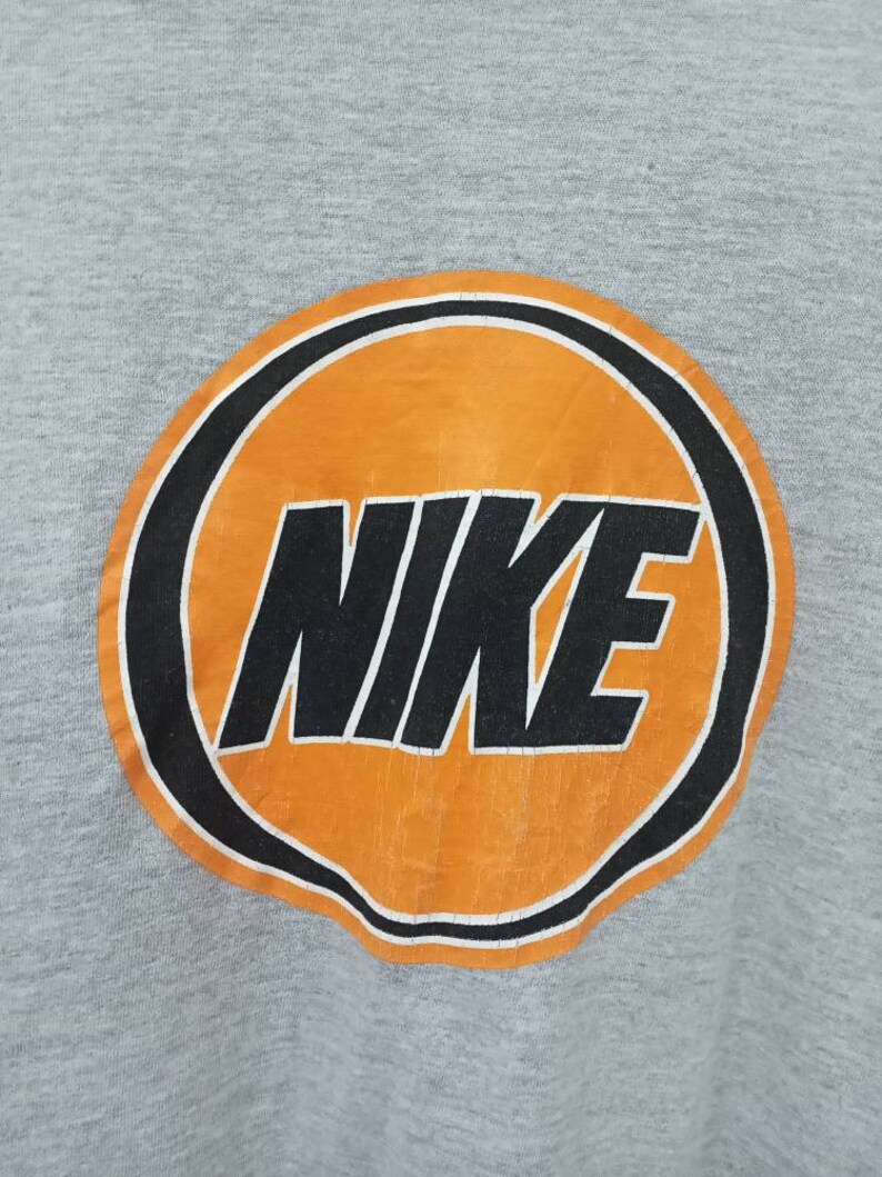 May include: A set of three ceramic vases in varying sizes and shapes. The vases are glazed in a matte white finish and feature a textured, ridged design. They are arranged on a neutral surface, showcasing their minimalist aesthetic.