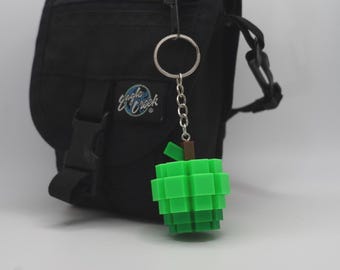 Llavero de manzana de azúcar inspirado en Roblox "Cultiva un jardín"