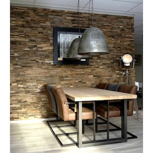 May include: A rustic wooden wall with a reclaimed wood paneling design. A wooden table with a metal frame sits in front of the wall. The table is surrounded by six chairs with brown leather seats. Three pendant lights hang from the ceiling above the table.