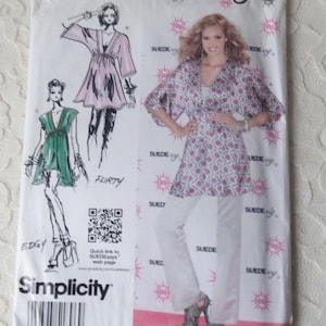 May include: A sewing pattern for a wrap top and pants. The pattern is from Simplicity and is called "Suede Says". The pattern number is 1896A. The pattern includes three different styles: "Classic", "Edgy", and "Flirty".