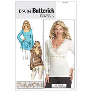 May include: A sewing pattern for a women's top with a V-neck and long sleeves. The pattern includes three different styles, one with a blue top, one with a brown and white striped top, and one with a white top with a beaded neckline. The pattern is from Butterick and is labeled B5084.