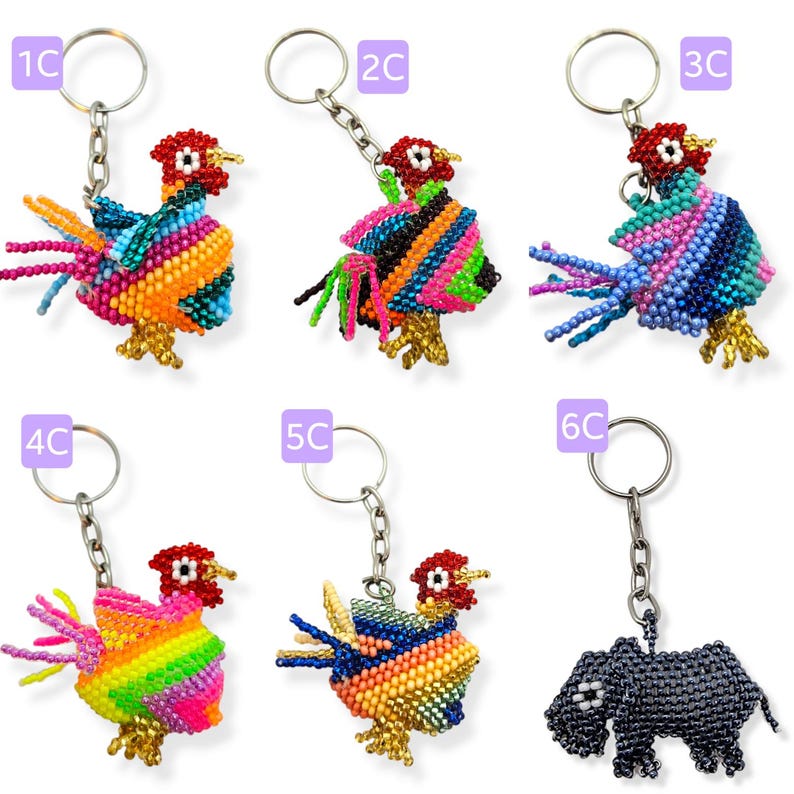 May include: Six colorful beaded keychains featuring rooster and rhino designs. The keychains are made with small, colorful beads and have a silver metal ring.