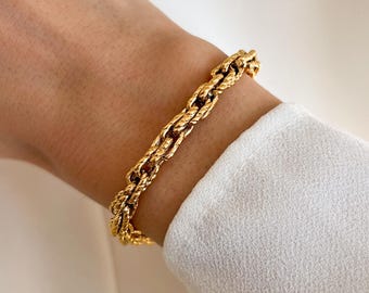 Women's stainless steel bracelet with a thick gold chain