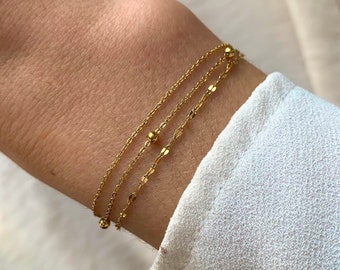 Women's stainless steel triple row fine chain bracelet