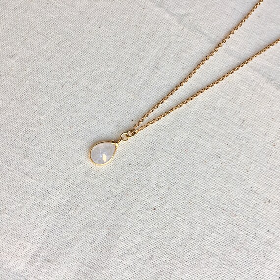 Gold store drop pendant