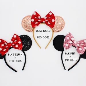 May include: Three headbands with circular ears and bows. Top: rose gold sequin ears with a red bow and white dots. Bottom left: black sequin ears with a red bow and white dots. Bottom right: black felt ears with a pink bow and white dots.