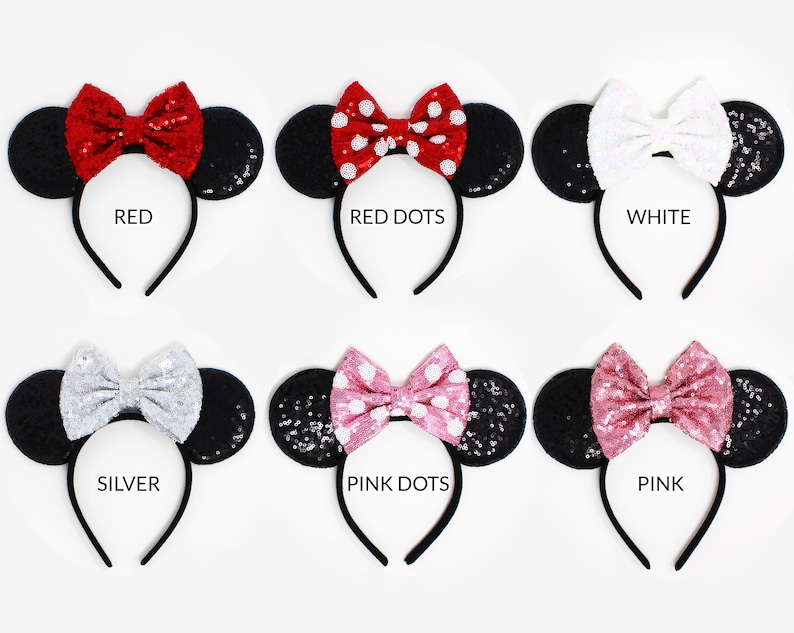 May include: Six headbands with black sequined ears and various bows: red, red with white dots, white, silver, pink with white dots, and pink. Each headband is labeled with its color name: RED, RED DOTS, WHITE, SILVER, PINK DOTS, and PINK.