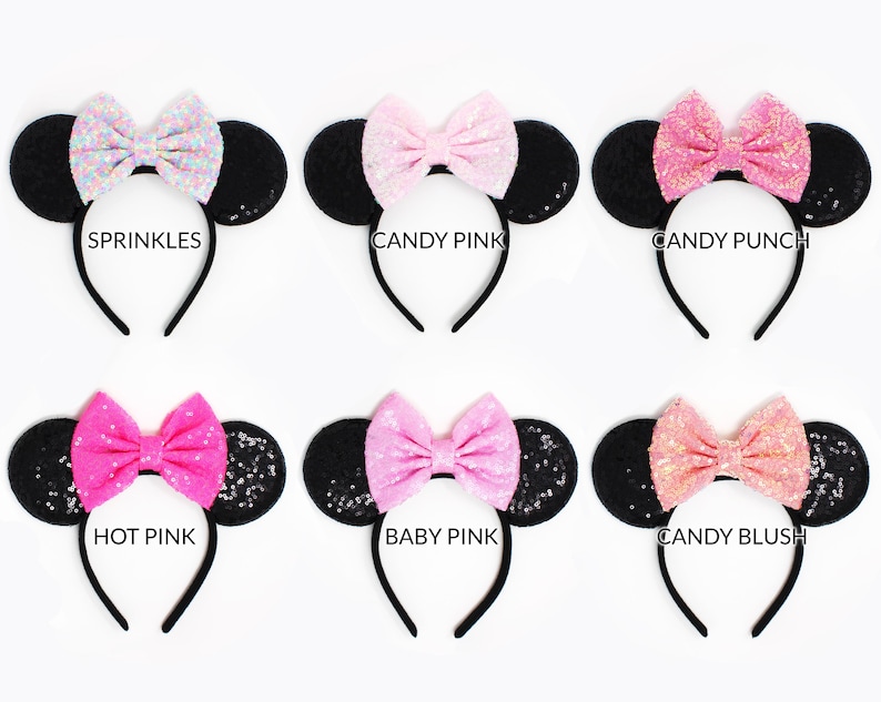 May include: Six black sequined mouse ear headbands with colorful bows labeled Sprinkles, Candy Pink, Candy Punch, Hot Pink, Baby Pink, and Candy Blush. Each headband features round ears covered in black sequins and a central fabric bow.