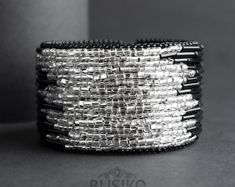 Wide black beaded cuff bracelet with silver bead strips. Statement big bracelet. High fashion jewelry. Elegant bead embroidered accessory.