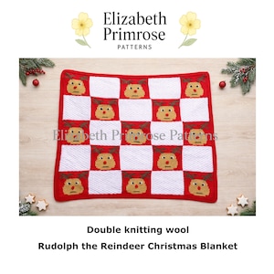 May include: A red and white knitted blanket featuring a checkerboard pattern with Rudolph the Reindeer faces. The blanket is made of double knitting wool and is a Christmas-themed item. The text "Rudolph the Reindeer Christmas Blanket" is visible.