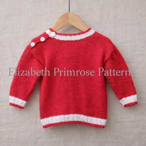 May include: A long-sleeved knit sweater in bright red with white ribbed trim at the crew neckline, cuffs, and hem. The sweater features three small white buttons along the left shoulder seam and the text Elizabeth Primrose Pattern.
