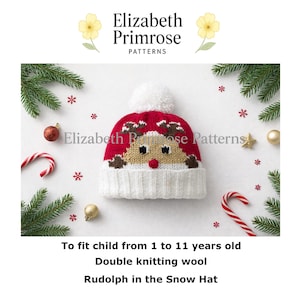 Op de afbeelding: Een rood-witte gebreide muts met een rendiergezichtontwerp en een witte pompon bovenop. De tekst luidt: Elizabeth Primrose Patterns, To fit child from 1 to 11 years old, Double knitting wool, Rudolph in the Snow Hat.