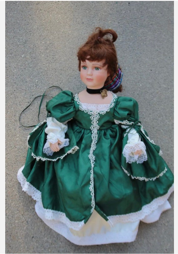 porcelain doll with green dress Green bird dress for 16” Elise – Vintage Doll Boutique main image 0