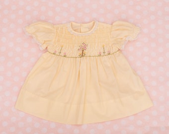 Babymeisje hand gesmokte gele jurk