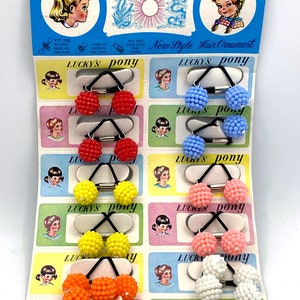 Carte originale et complète avec élastiques pour cheveux. Luckys poney
