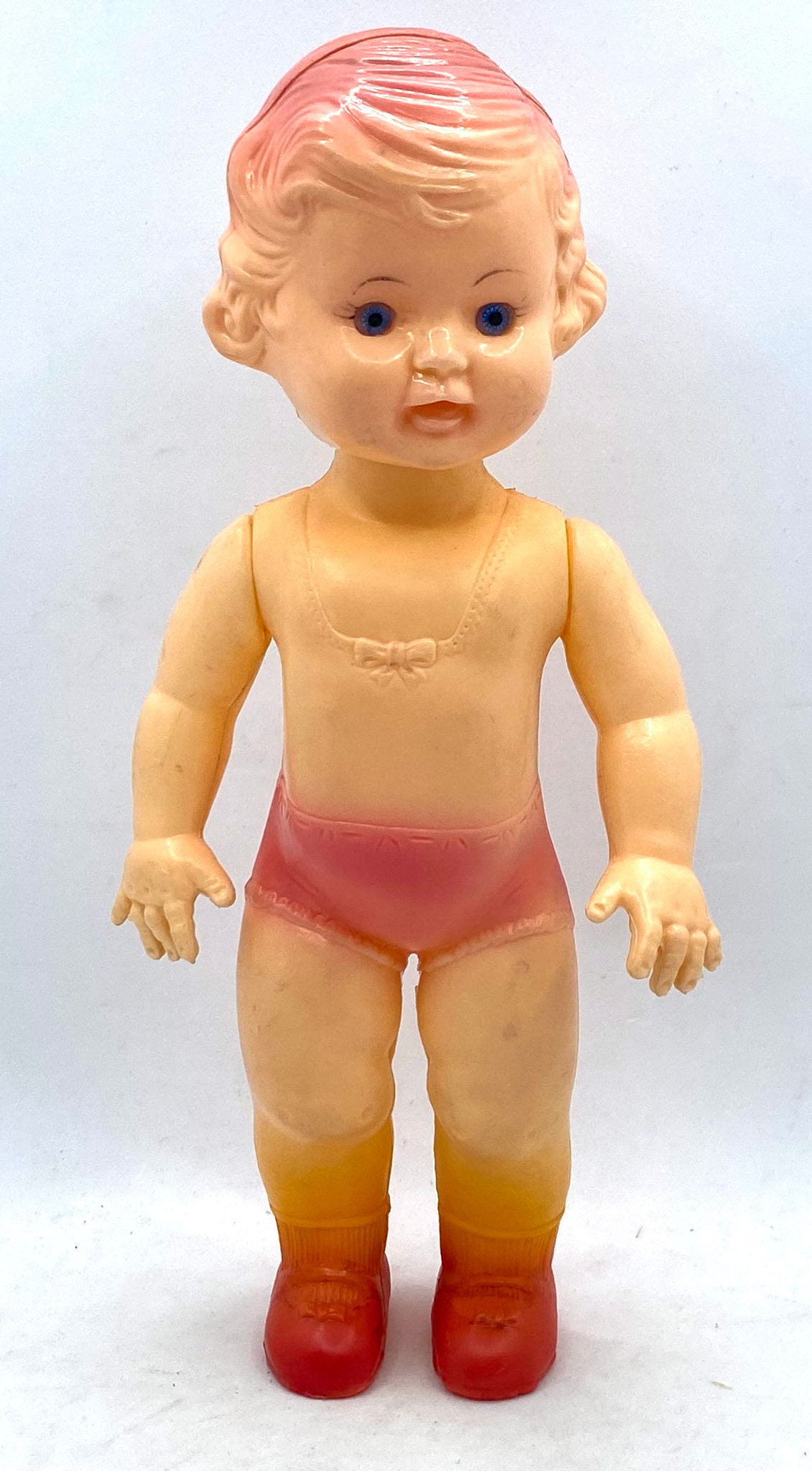 Celluloid doll. Movable arms. 25 cm high. 50s.
