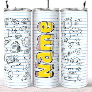 May include: A white, stainless steel tumbler with a lid and straw. The tumbler is covered in a lined paper design with school-themed doodles and the name "Name" in large yellow pencil-shaped letters.