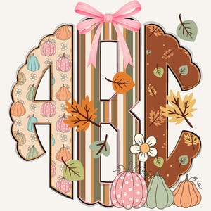 May include: A fall-themed monogram design featuring the letters "ABC". The letter "A" is filled with pumpkins and flowers, "B" has vertical stripes, and "C" is adorned with leaves. A pink bow sits atop the design, with additional pumpkins and leaves scattered around.