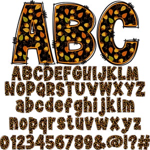 May include: A complete alphabet and number set in a fall theme. The letters and numbers are filled with a pattern of acorns and leaves in shades of orange, yellow, and brown against a black background. The letters have a black outline.