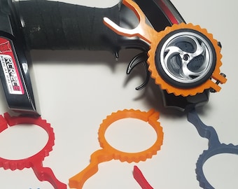 May include: A black remote control with an orange wheel attachment and four additional orange, red, and blue wheel attachments. The remote control has the text "RC926E REAL RACING" on the side.