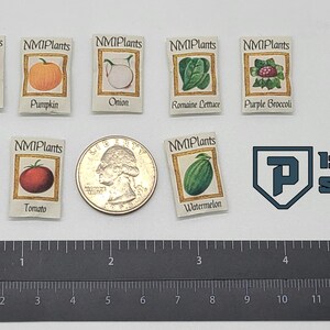 May include: Miniature seed packets labeled with various vegetables, including radish, pumpkin, and tomato. A quarter and a ruler with inches are also present. The scale is 1:6.