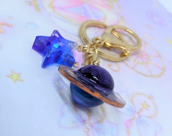Bella resina pianeta saturno e portachiavi stella