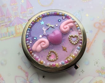 Specchio compatto e portapillole con grazioso cuore alato