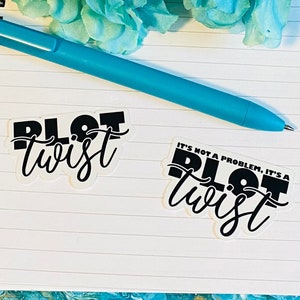 May include: Two white stickers with black text on a lined notebook. The top sticker says "Plot Twist". The bottom sticker says "It's not a problem, it's a Plot Twist".