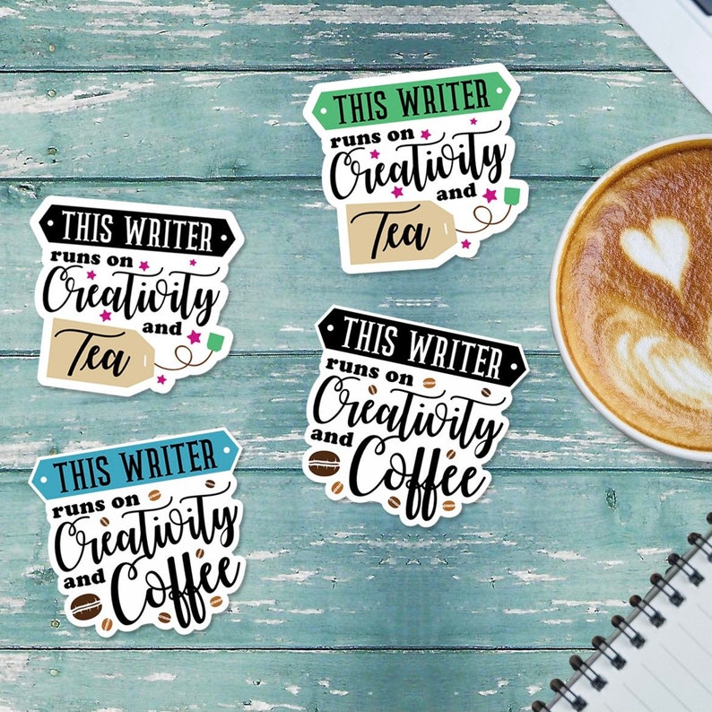 May include: Four colorful stickers with the text "This writer runs on creativity and [beverage]" with the beverage being tea or coffee. The stickers are on a blue wooden background.