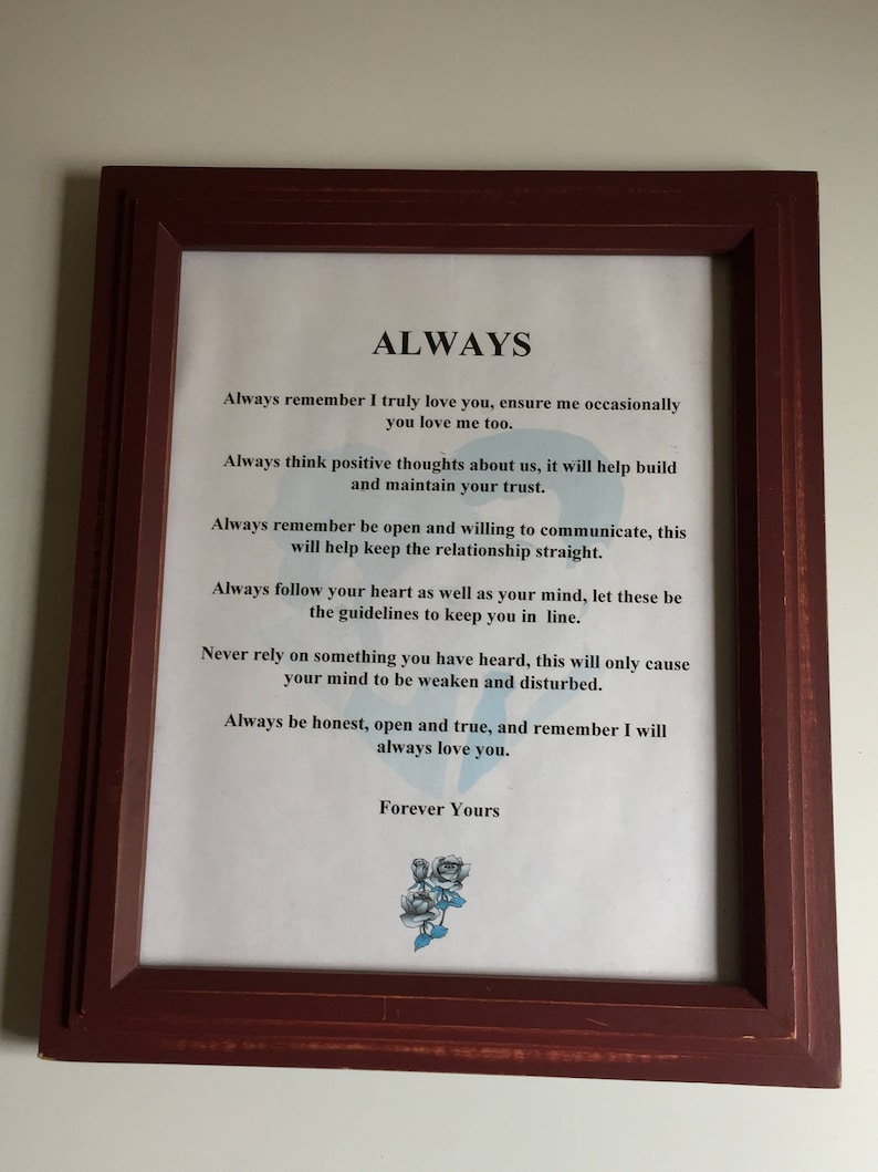 May include: A framed print with a white background and brown wood frame. The print features a poem titled "ALWAYS" with a message about love and relationships. The poem includes the text "Always remember I truly love you, ensure me occasionally you love me too." and "Forever Yours".